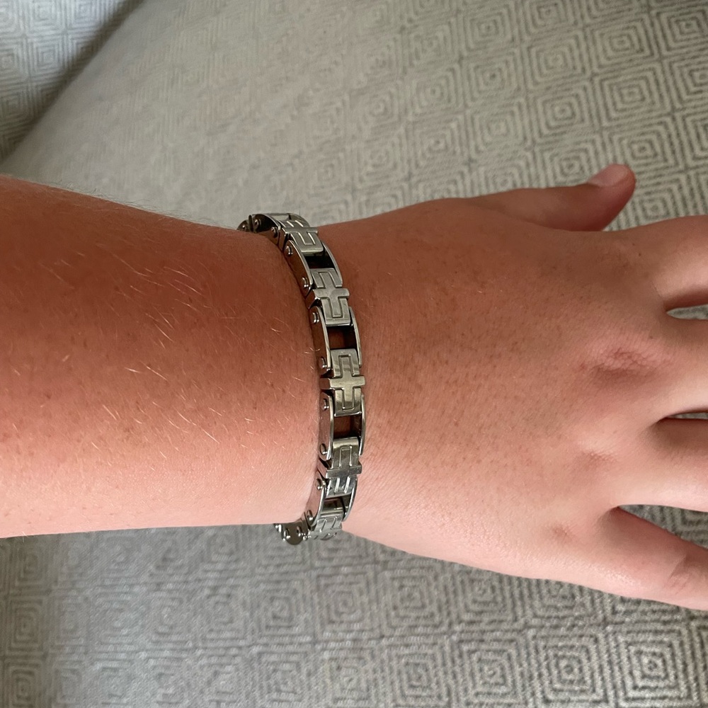 Men’s stainless steel cross bracelet.